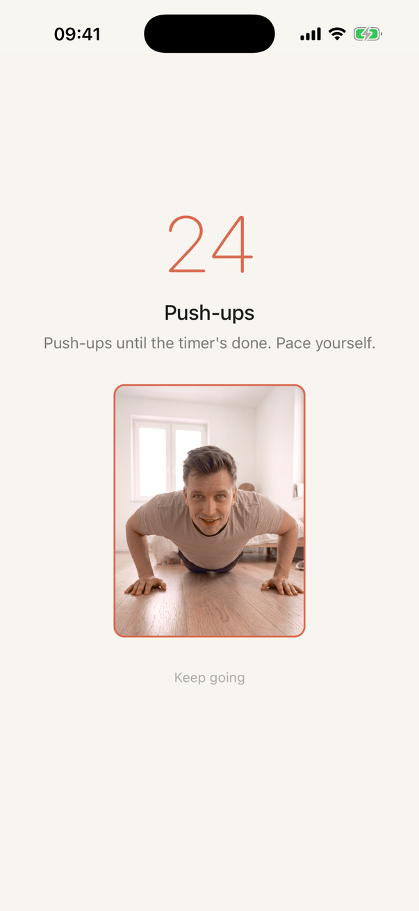 A push-ups session: the countdown at 24 and a live view from the phone's camera showing someone mid push-up